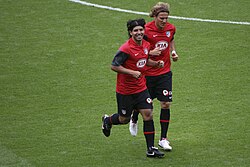 Atlético's striker partnership during this era: Sergio Agüero (left) and Diego Forlán (right). Forlán won the European Golden Shoe in 2009.