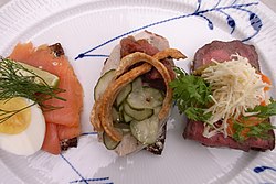 Smørrebrød, a variety of Danish open sandwiches piled high with delicacies