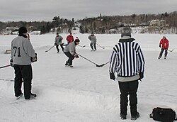 A game of pond hockey being played in Lac-Beauport, Quebec