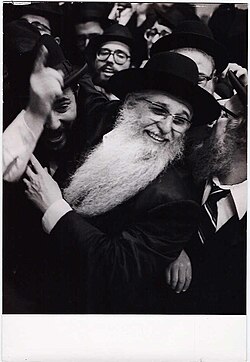 Aaron Schechter (white beard) celebrating Purim in Yeshiva Rabbi Chaim Berlin during the late 1970s.