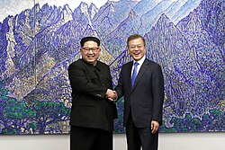 North Korean leader Kim Jong Un and South Korean President Moon Jae-in shaking hands inside the Peace House on 27 April 2018