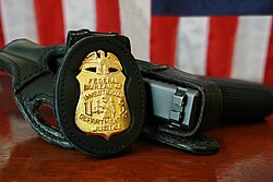 FBI badge and service pistol, a Glock Model 22, .40 S&W caliber