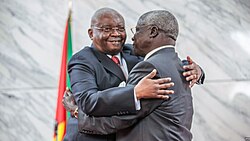 Afonso Dhlakama (right) ratifying the 2014 peace deal with Mozambique's President Armando Guebuza
