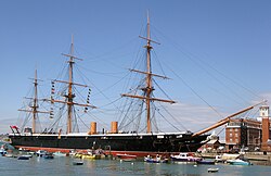 HMS Warrior, the first iron-hulled armoured steam frigate – the hull survived as an oil terminal dock and was restored to its original appearance in the late 20th century