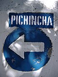 A street sign properly marked Pichincha St., formerly Ricchieri St.