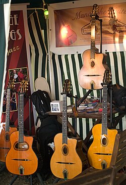 Selmer-Maccaferri–type guitars, with distinctive sound holes and "floating" wooden bridges