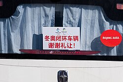 Buses serving the Olympic bubble have red stickers on front and rear