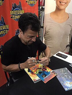 Artist John Romita Jr., signing a copy of issue 254 of the series at Midtown Comics in Manhattan