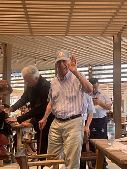 Vargas Llosa wearing a cap from Club Universitario de Deportes, the Peruvian soccer team he supported as a youth