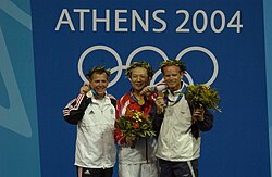 Army Maj. Zhanbo Jia from China (center) took the gold medal in the Men's 50m Three-Position Rifle, Michael Anti from the United States (left) took the Silver and Christian Planer (right) from Austria took the Bronze