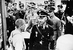 Heinrich Himmler (front right, beside prisoner) inspecting Dachau Concentration Camp on 8 May 1936