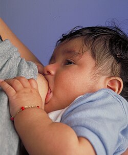 Breastfeeding an infant.