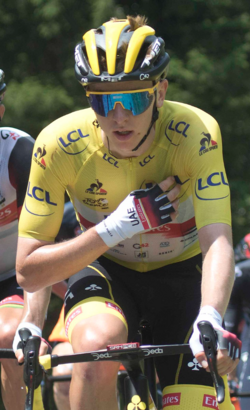 Pogačar wearing the race leader's yellow jersey during stage 14 of the 2021 Tour de France