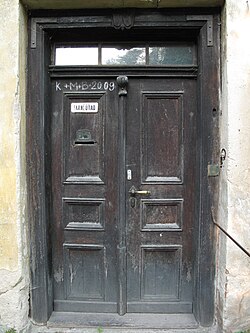 K † M † B † 2009 written on a door of a rectory in a Czech village, to bless the house by Christ. Christians of various denominations, including Catholics, Lutherans and Anglicans practice the chalking the door on Epiphanytide.
