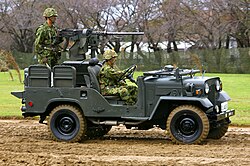 A vehicle with a Sumitomo M2 heavy machine gun mounted at the rear