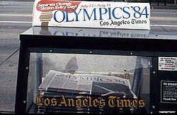 Newspaper vending machine announcing the 1984 Olympics.