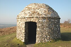 Stone structure built in 1588 to support a wooden pole and fire basket(s). Fire(s) would be lit as a signal that the Spanish Armada had been sighted. Of the chain of beacon sites across Southern England, this is the only remaining stone structure.
