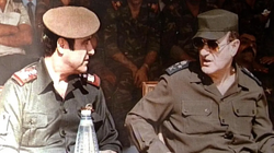Ba'athist leader Hafez al-Assad alongside his brother Rifaat al-Assad at a military ceremony in Damascus, 1984