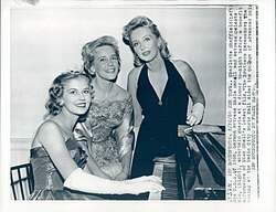 Charlotte Sheffield, Maria Schell, and Celeste Holm entertain guests at a dinner to-night, 1958