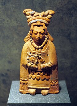 Molded female figurine.