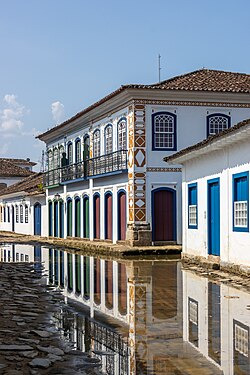 Water floods Paraty's streets during high tide